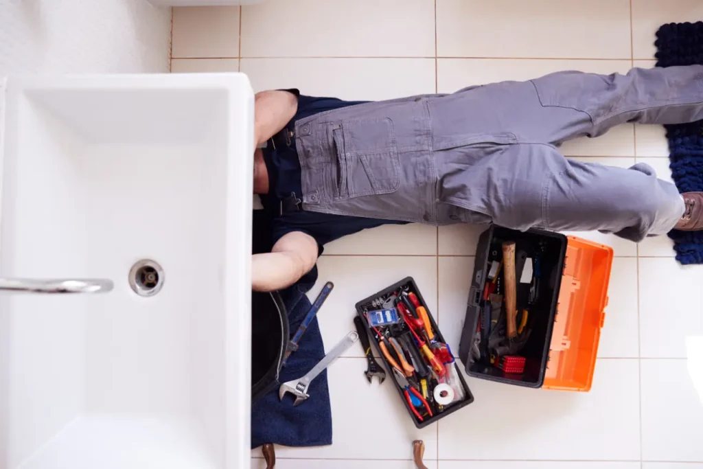 overhead-shoot-of-male-plumber-working-to-fix-leaking