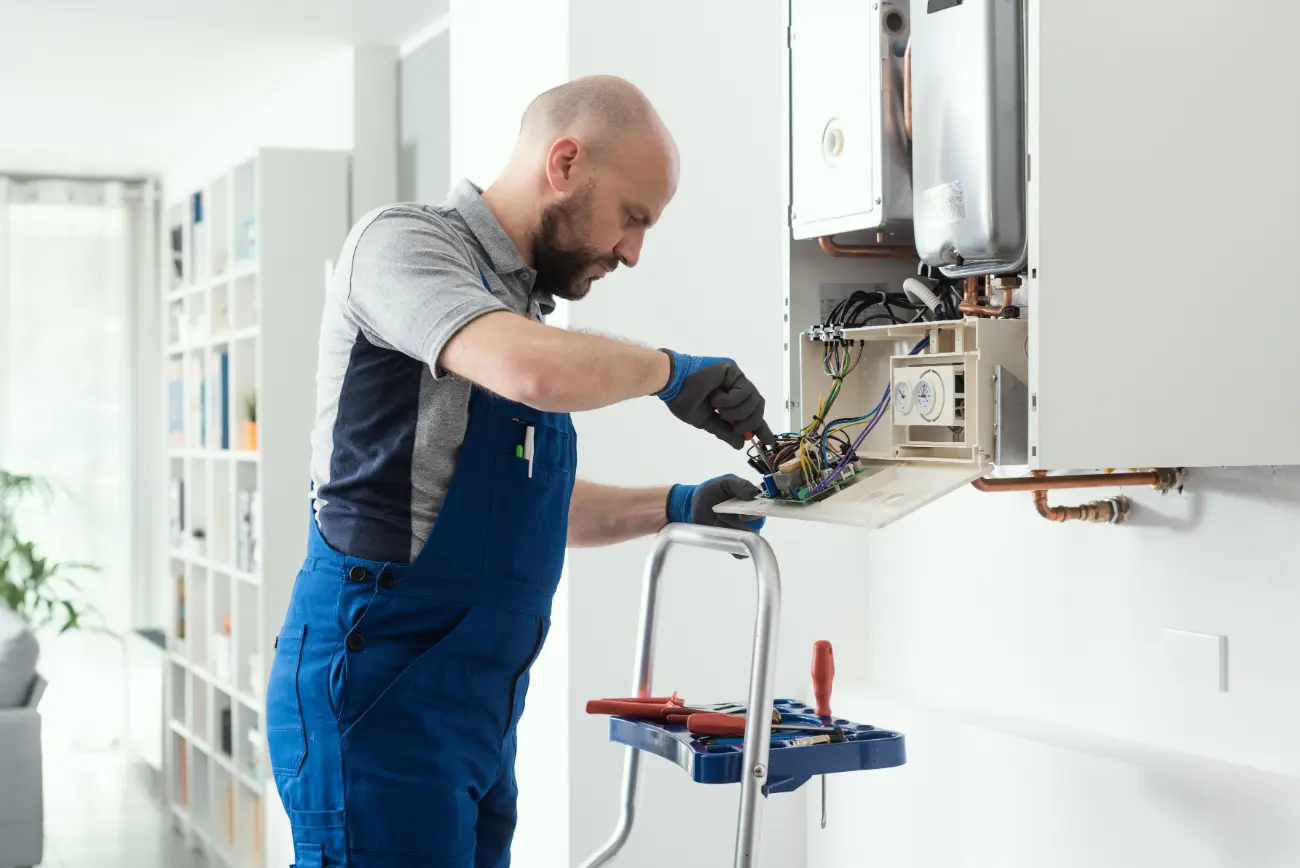 qualified-engineer-servicing-a-boiler